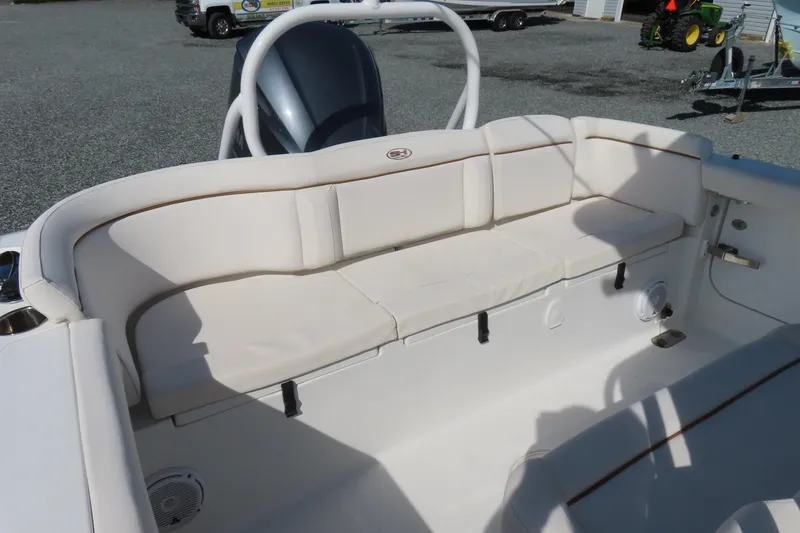 Slide: The Image of 2020 Sea Hunt Ultra 255 SE boat with white cushioned seating area. - 32