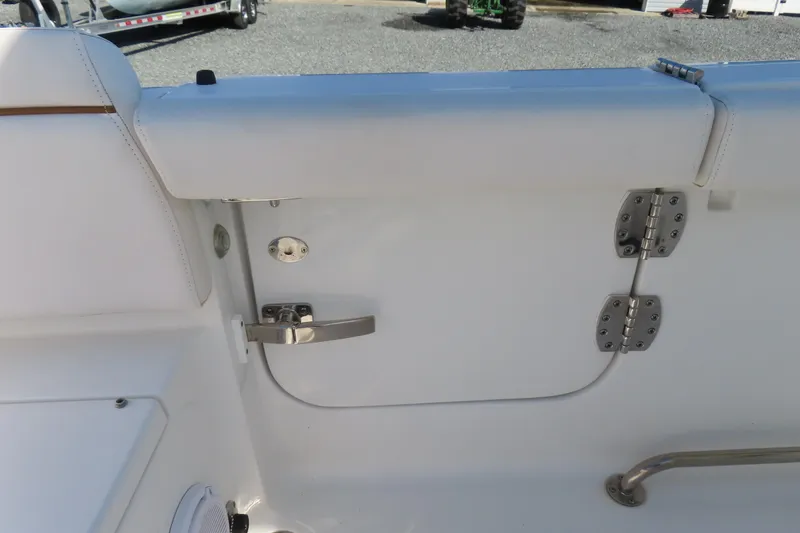Slide: The Image of 2020 Sea Hunt Ultra 255 SE boat interior with stainless steel hinges and latch. - 42