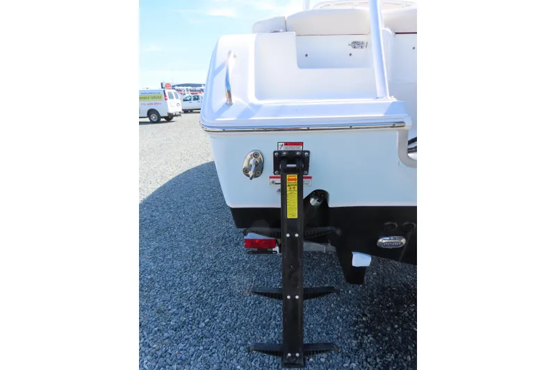 Slide: The Image of Rear view of a 2020 Sea Hunt Ultra 255 SE boat on gravel. - 6