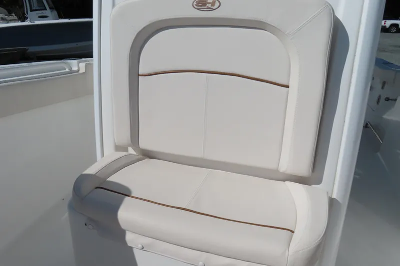 Slide: The Image of 2020 Sea Hunt Ultra 255 SE boat seat with white cushioned upholstery. - 7