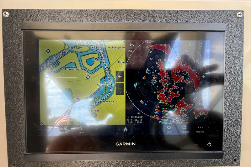 Slide: The Image of Garmin navigation display on 2006 Sea Ray 290 Sundancer, showing map and radar interface. - 25