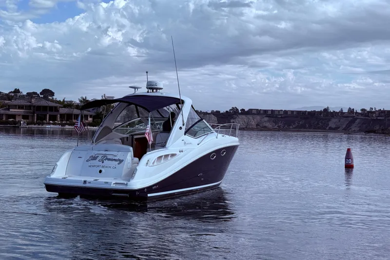 Slide: The Image of 2006 Sea Ray 290 Sundancer boat on calm water near Newport Beach, CA. - 3