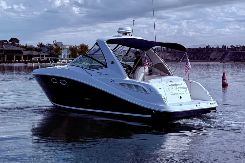 Slide: The Image of 2006 Sea Ray 290 Sundancer boat cruising on calm waters near Newport Beach. - 4