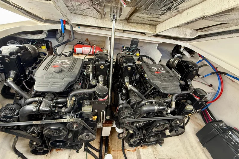Slide: The Image of Engine compartment of a 2006 Sea Ray 290 Sundancer with twin MerCruiser engines. - 44