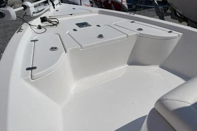 Slide: The Image of 2016 Blazer Bay 1960 boat interior with storage compartments and seating. - 3