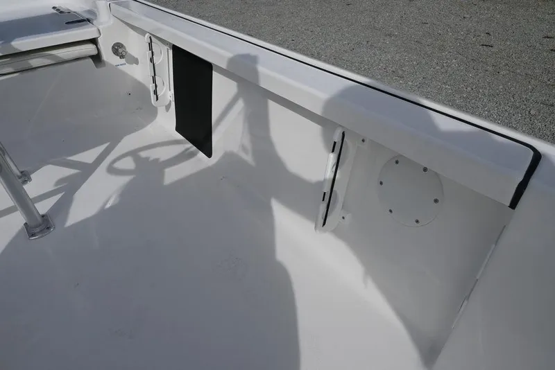 Slide: The Image of 2026 Tidewater 1910 Bay Max boat interior with steering wheel and seating area. - 14