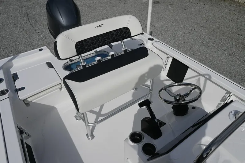Slide: The Image of 2026 Tidewater 1910 Bay Max boat interior with steering wheel and seating. - 15