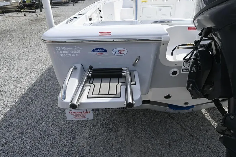 Slide: The Image of 2026 Tidewater 1910 Bay Max boat with swim platform and outboard motor. - 7