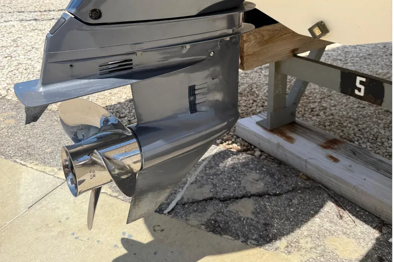 Slide: The Image of 2016 Chaparral 230 Suncoast boat propeller and lower unit on a trailer. - 15