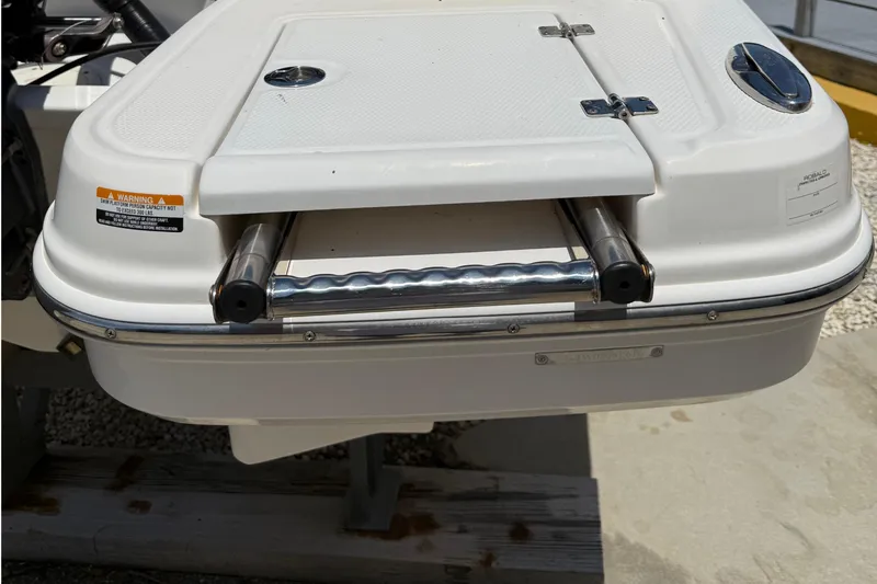 Slide: The Image of 2016 Chaparral 230 Suncoast boat swim platform with retractable ladder. - 18