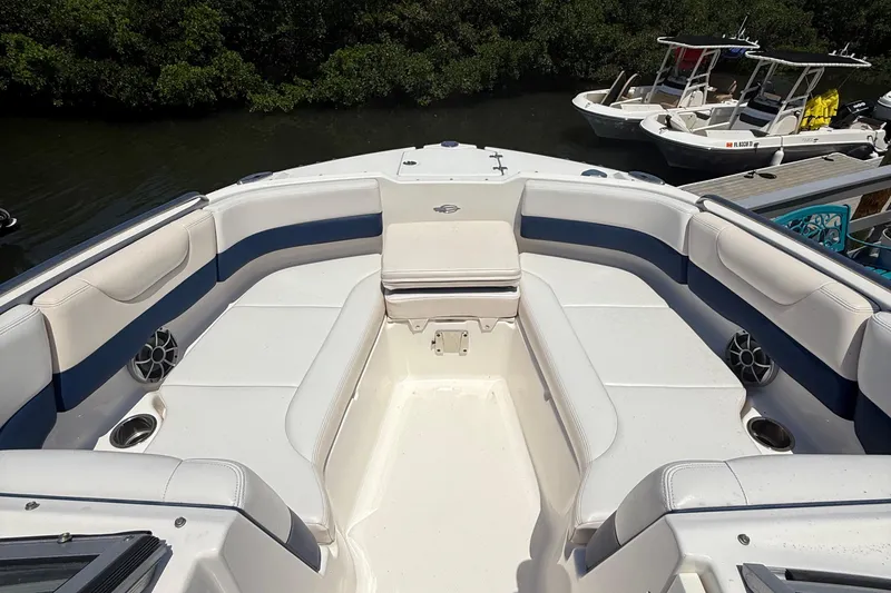 Slide: The Image of 2016 Chaparral 230 Suncoast boat interior with spacious seating and cup holders. - 27
