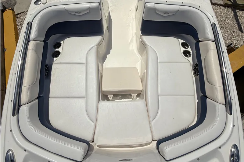 Slide: The Image of 2016 Chaparral 230 Suncoast boat interior with white seating and cup holders. - 31