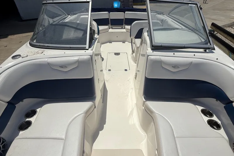 Slide: The Image of 2016 Chaparral 230 Suncoast boat interior with white and blue seating. - 32