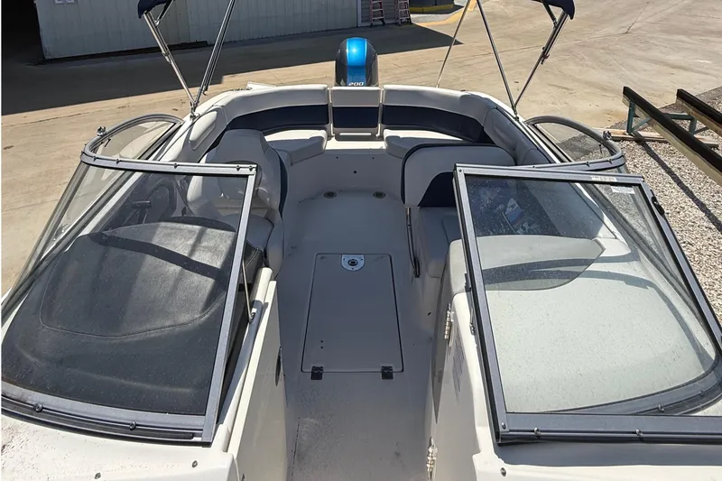 Slide: The Image of 2016 Chaparral 230 Suncoast boat interior with open seating and windshield. - 36