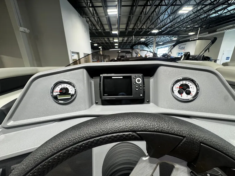 Slide: The Image of Dashboard of 2026 Sylvan R-20 PARTY FISH with steering wheel and gauges. - 13