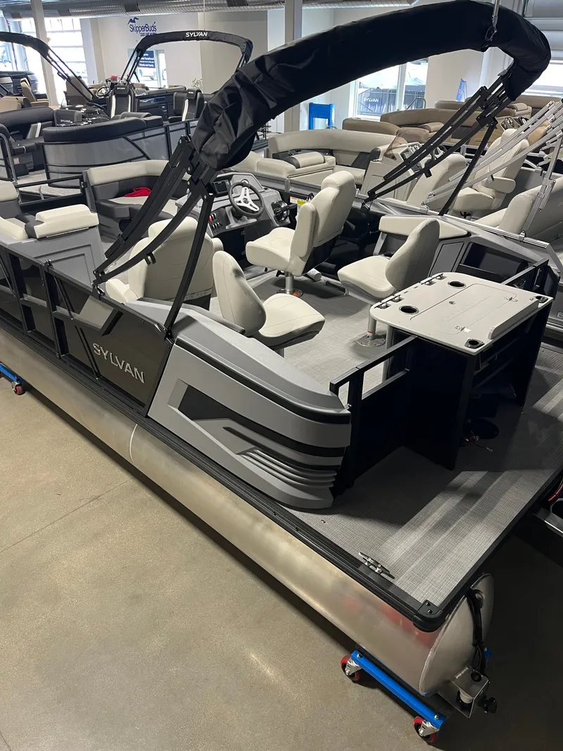 Slide: The Image of 2026 Sylvan R-20 PARTY FISH pontoon boat in showroom. - 2