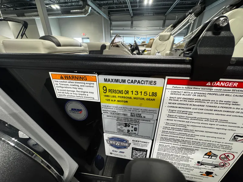 Slide: The Image of Safety and capacity labels on a Sylvan R-20 PARTY FISH boat. - 9