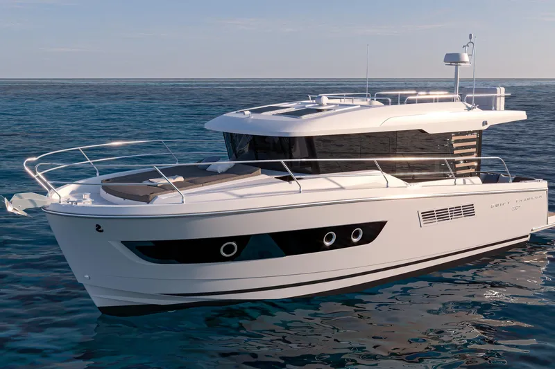 Slide: The Image of 2026 Beneteau Swift Trawler 37 cruising on the ocean with scenic mountain backdrop. - 10