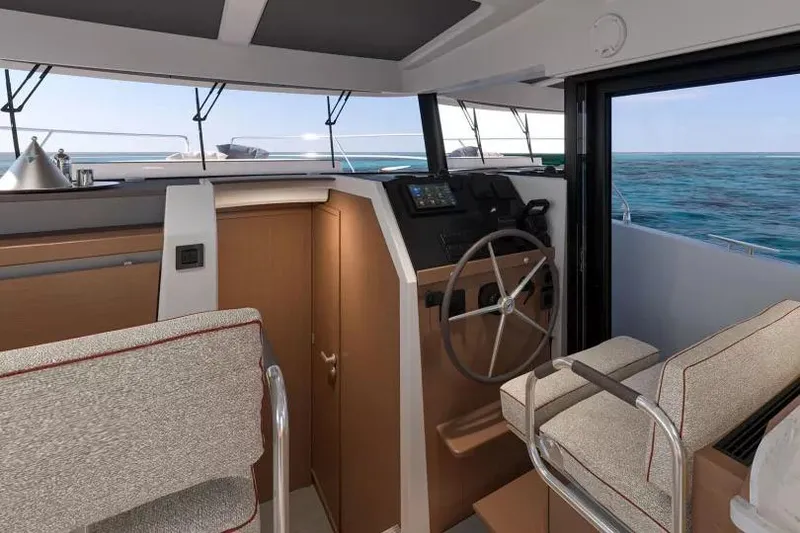 Slide: The Image of Interior of 2026 Beneteau Swift Trawler 37, featuring helm and ocean view. - 22