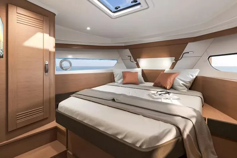 Slide: The Image of Luxurious cabin interior of 2026 Beneteau Swift Trawler 37 with modern design and cozy bedding. - 23