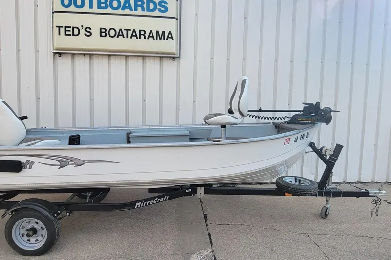 Slide: The Image of 2014 MirroCraft 1400 boat on trailer at Ted's Boatarama dealership. - 12
