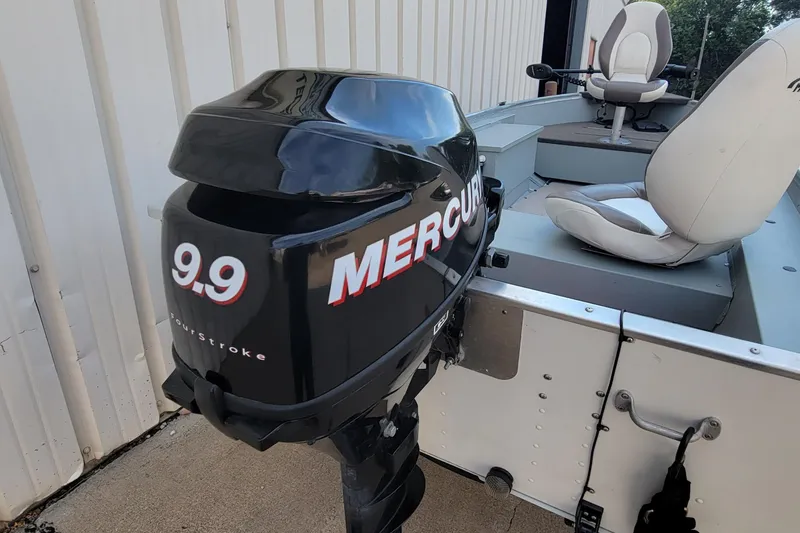 Slide: The Image of 2014 MirroCraft 1400 boat with Mercury 9.9 FourStroke outboard motor. - 14