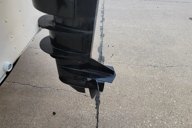 Slide: The Image of 2014 MirroCraft 1400 boat motor propeller on concrete surface. - 16