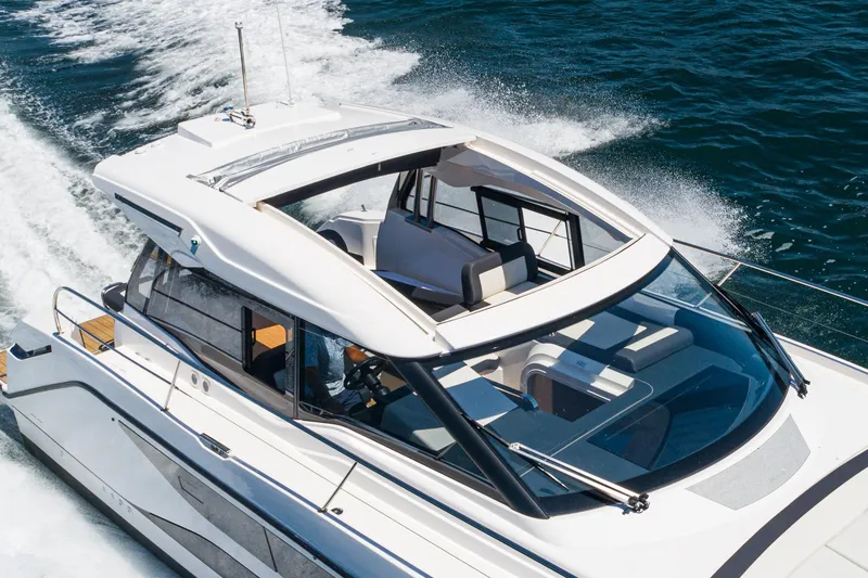Slide: The Image of 2024 Bavaria SR38 yacht cruising on open water, showcasing sleek design and luxury features. - 15