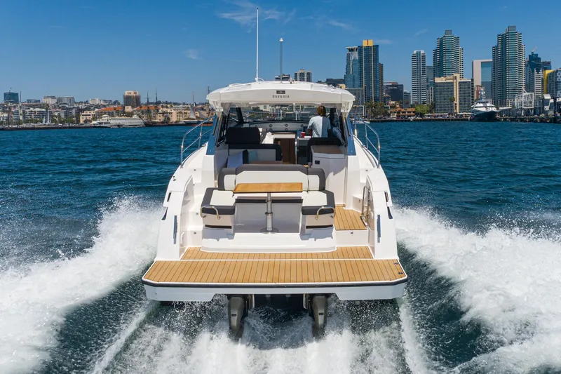 Slide: The Image of 2024 Bavaria SR38 yacht cruising near city skyline on a sunny day. - 17