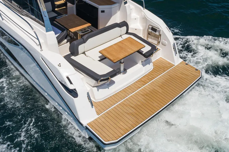 Slide: The Image of 2024 Bavaria SR38 yacht with elegant deck and seating area on the water. - 18