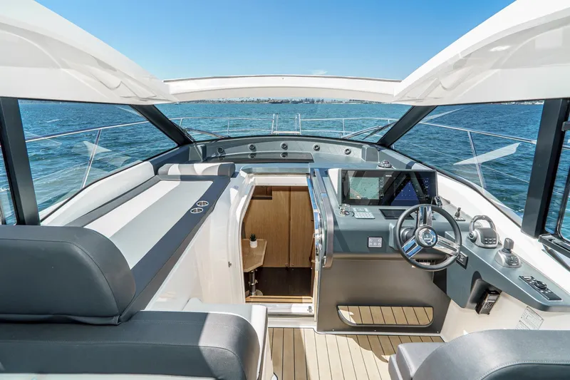 Slide: The Image of 2024 Bavaria SR38 yacht cockpit with modern controls and ocean view. - 30