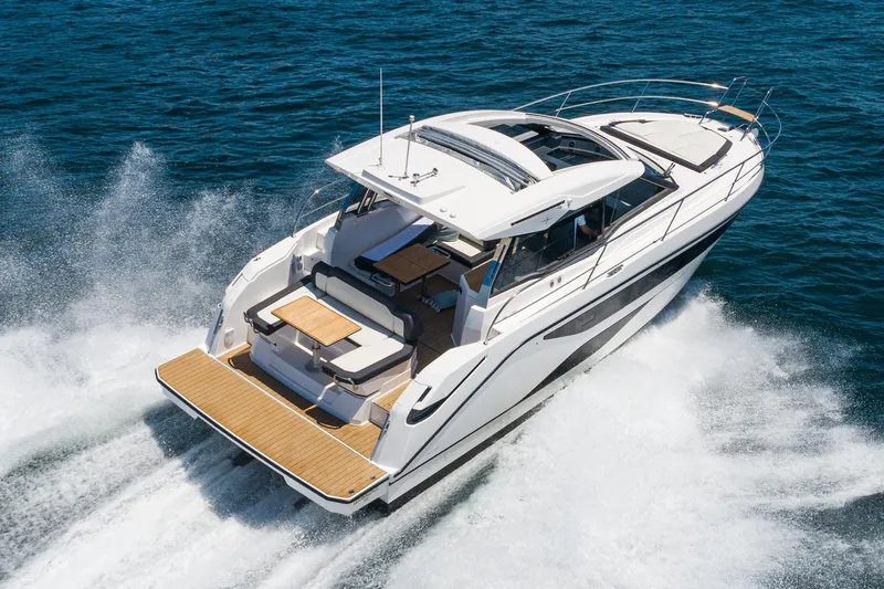 Slide: The Image of 2024 Bavaria SR38 yacht cruising on open water, showcasing sleek design and luxury features. - 4
