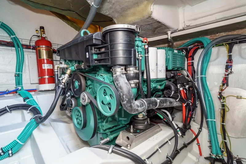 Slide: The Image of Engine room of 2024 Bavaria SR38 yacht, showcasing detailed mechanical components and wiring. - 47