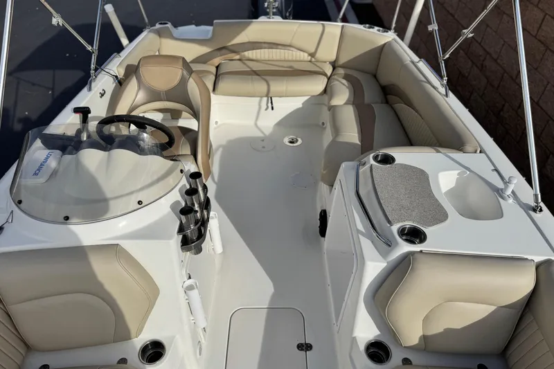 Slide: The Image of 2013 NauticStar 203 SC boat interior with beige seating and steering console. - 19
