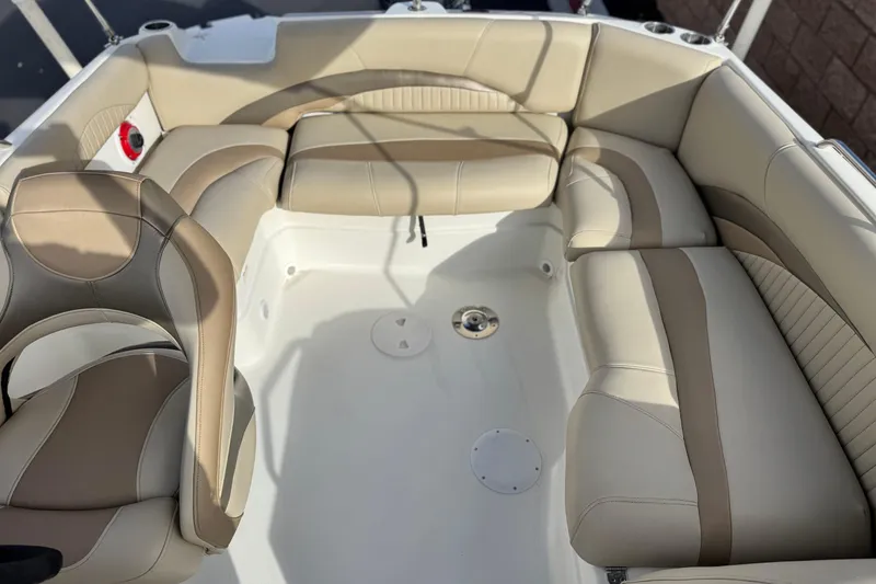 Slide: The Image of 2013 NauticStar 203 SC boat interior with beige seating and modern design. - 21