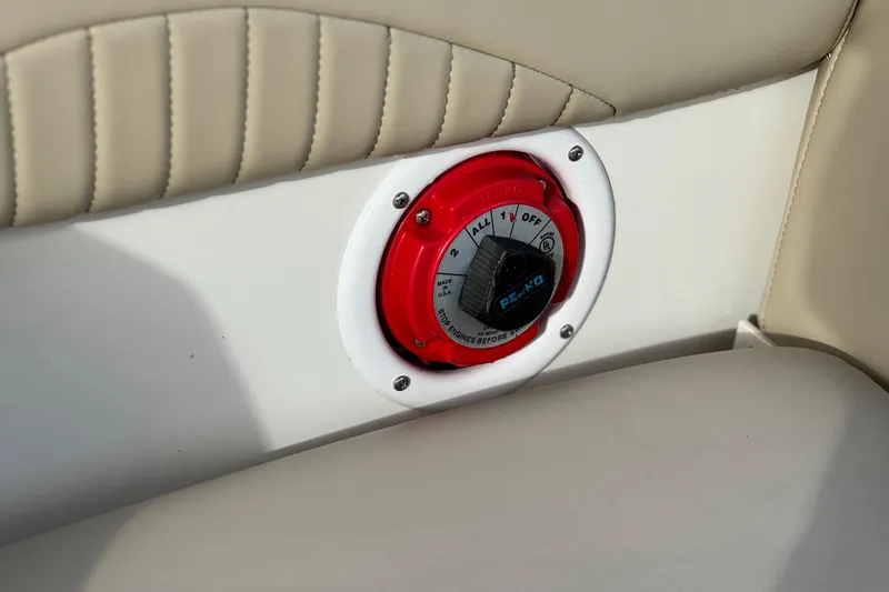 Slide: The Image of Battery switch on 2013 NauticStar 203 SC boat, featuring beige upholstery. - 22