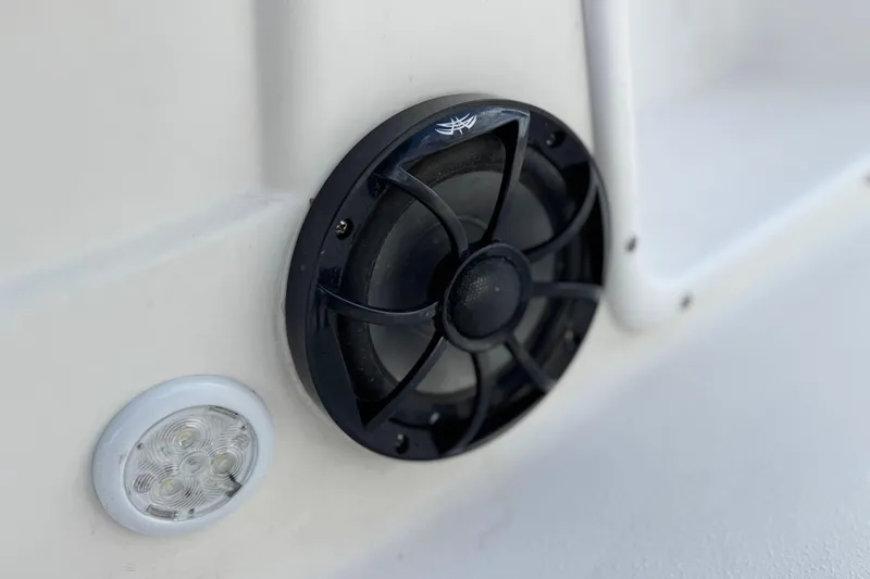 Slide: The Image of Close-up of a 2013 NauticStar 203 SC boat speaker and light on white surface. - 26
