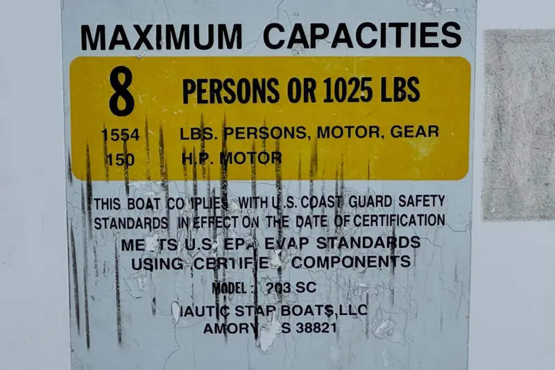 Slide: The Image of 2013 NauticStar 203 SC capacity label: 8 persons or 1025 lbs, 150 HP motor. - 35