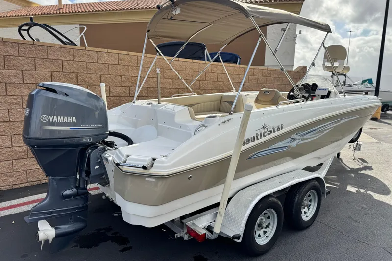Slide: The Image of 2013 NauticStar 203 SC boat with Yamaha outboard motor on trailer. - 5