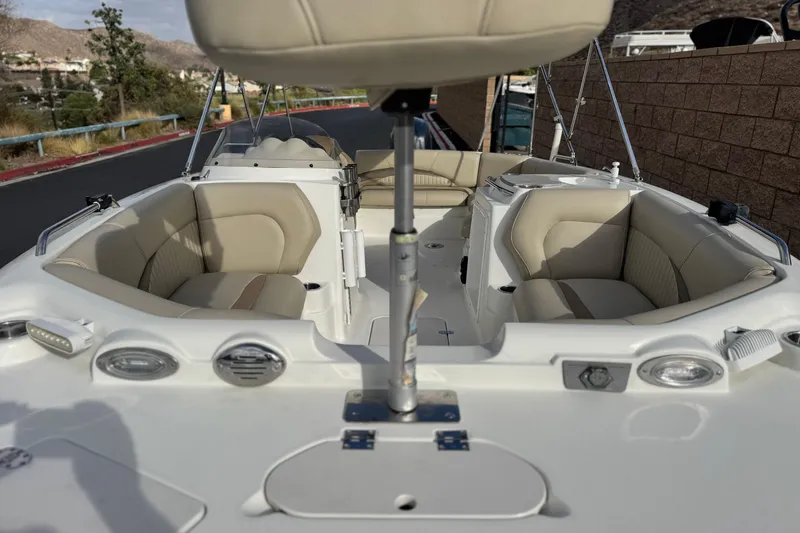 Slide: The Image of 2013 NauticStar 203 SC boat interior with beige seating and modern design. - 8