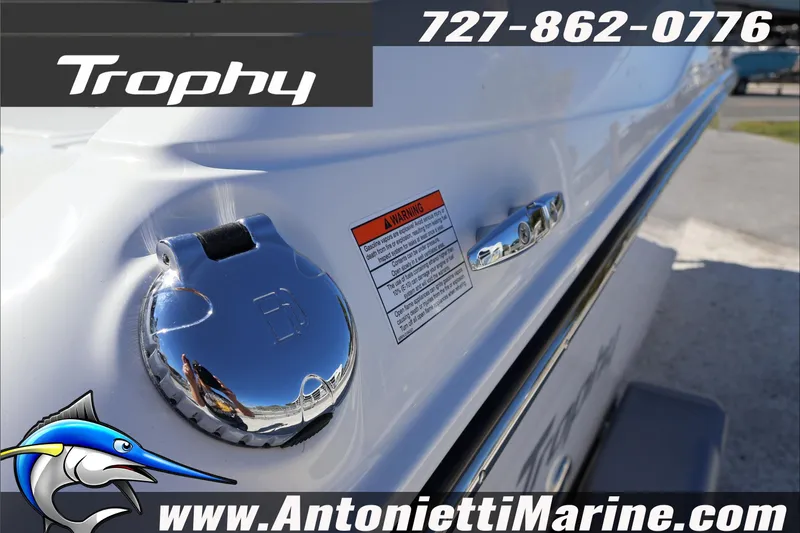 Slide: The Image of 2026 Trophy T18 Bay boat detail with chrome fittings and warning label, Antonietti Marine branding. - 11