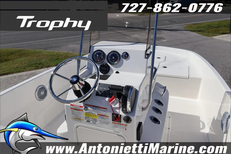 Slide: The Image of 2026 Trophy T18 Bay boat dashboard with steering wheel and gauges, Antonietti Marine branding. - 12