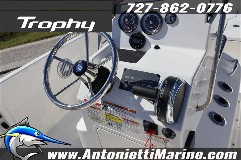 Slide: The Image of 2026 Trophy T18 Bay boat dashboard with steering wheel and controls, Antonietti Marine branding. - 16
