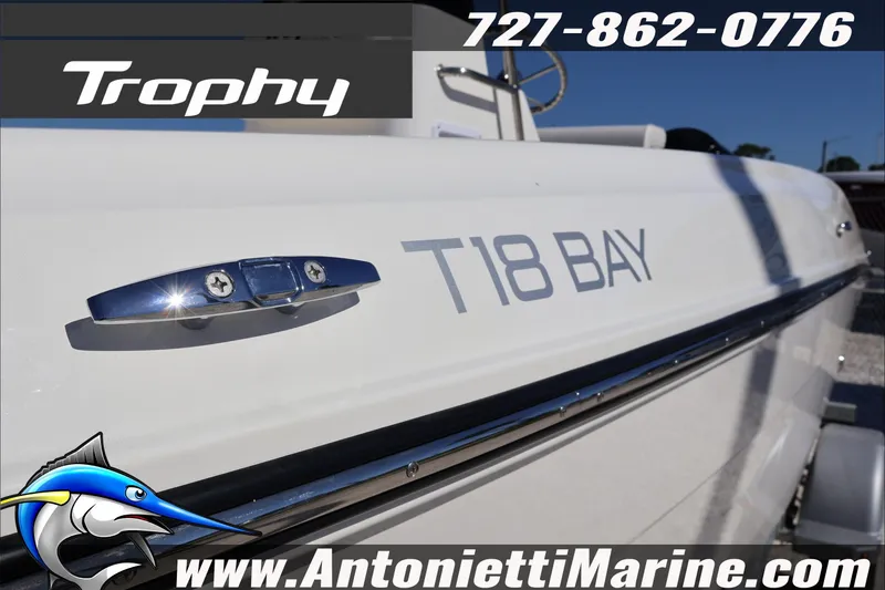 Slide: The Image of 2026 Trophy T18 Bay boat side view with logo and contact details. - 9
