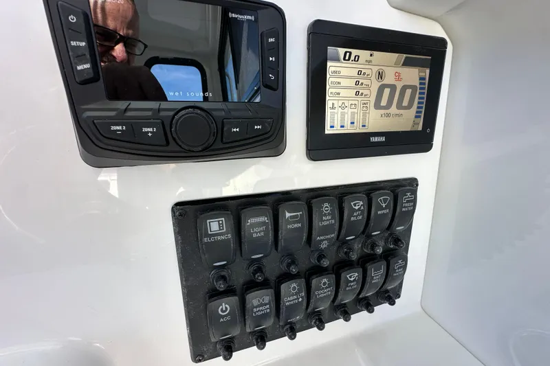 Slide: The Image of Control panel of 2026 Parker 227 Explorer boat with Yamaha display and switches. - 13