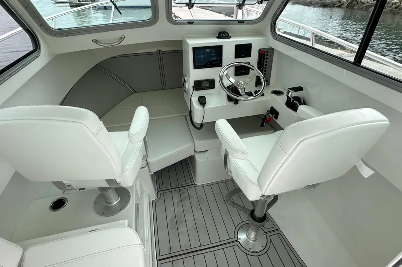 Slide: The Image of Throttle control system on a 2026 Parker 227 Explorer boat dashboard. - 3