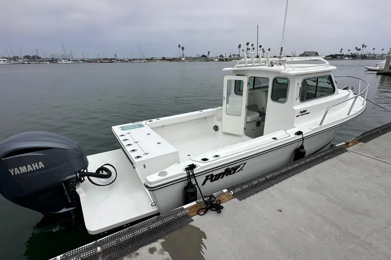 Slide: The Image of Interior of 2026 Parker 227 Explorer boat with white seating and modern design. - 7