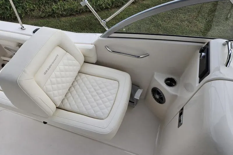 Slide: The Image of 2026 Grady-White Freedom 215 boat seat with quilted design and cup holders. - 19