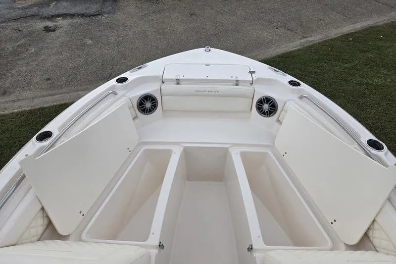 Slide: The Image of 2026 Grady-White Freedom 215 boat interior with open storage compartments. - 2