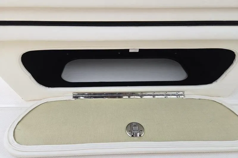 Slide: The Image of Open storage compartment on 2026 Grady-White Freedom 215 boat. - 20